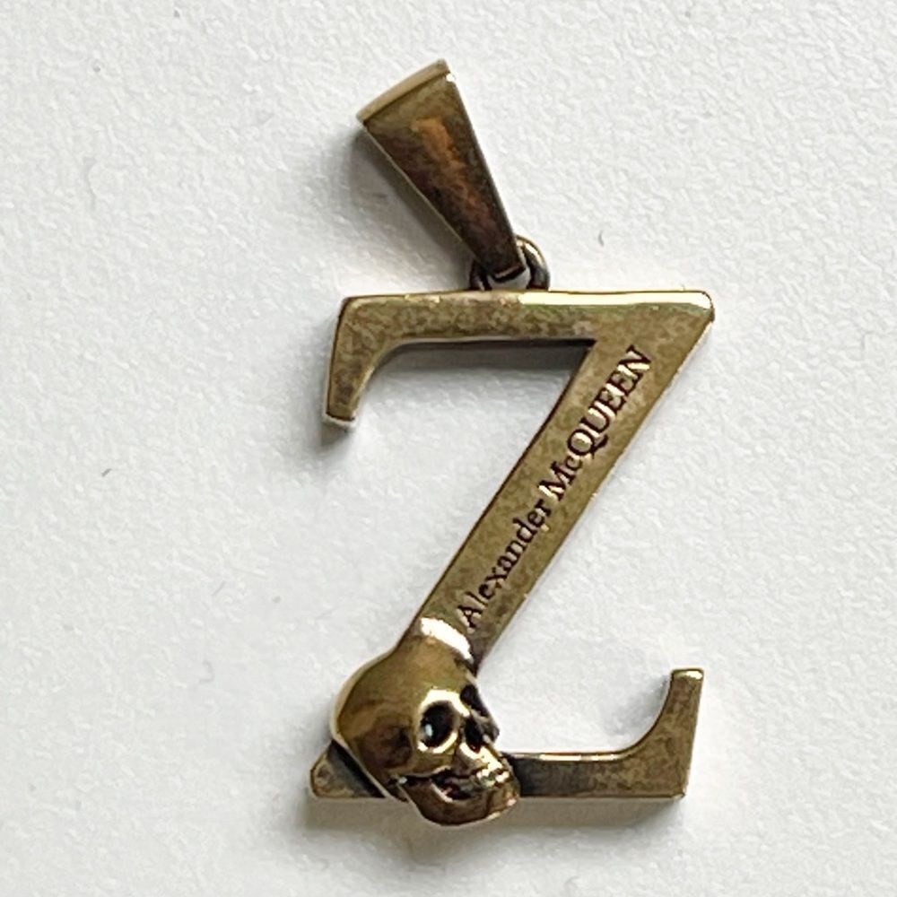 Alexander McQueen Z with scull necklace or zipper charm. One charm.